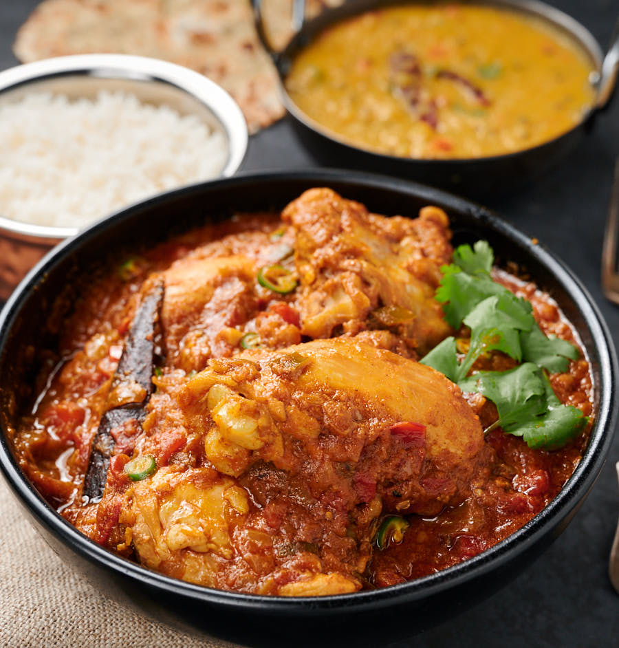 Serving dish of simple chicken curry from the front.