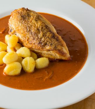 Chicken paprikash is traditionally braised. Try this recipe to keep the skin crisp while maintaining the depth of flavour of a braised dish