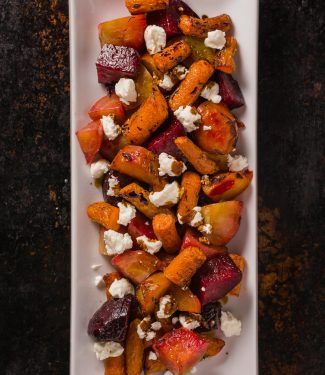 Roasted beets and carrots with goat cheese. This dish is brightened by a balsamic glaze to bring out the sweetness of the root vegetables.