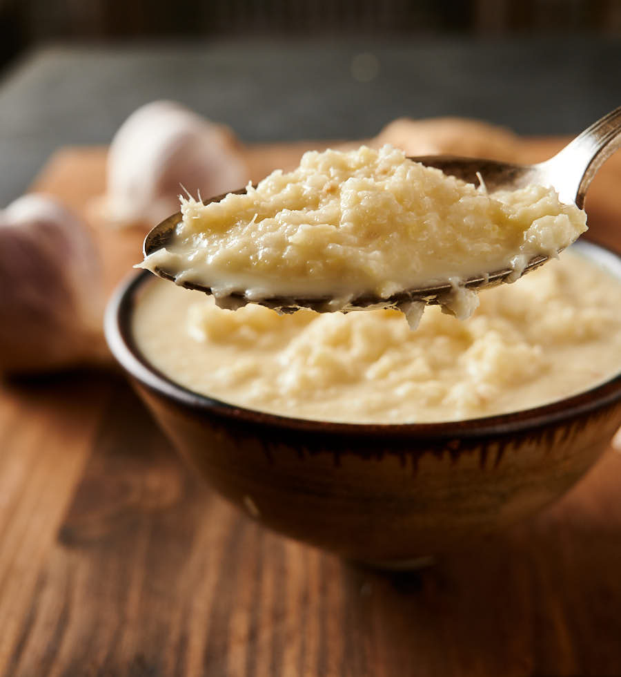 Big spoonful of garlic ginger paste close-up.