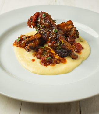 Melting pork back ribs, fire roasted tomatoes and cheese polenta come together in this fine dining riff on Mexican pork chili.