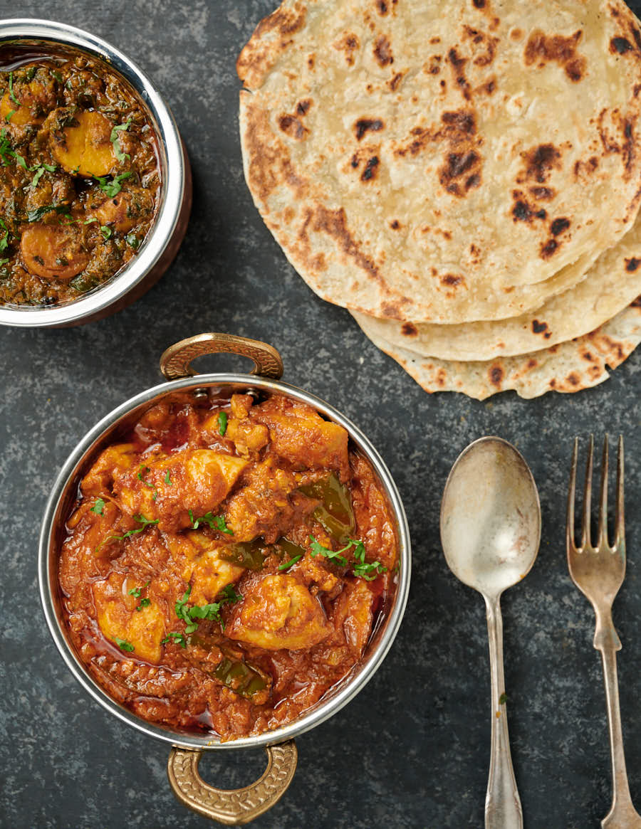 Chicken dopiaza curry with parathas and sag aloo from above.