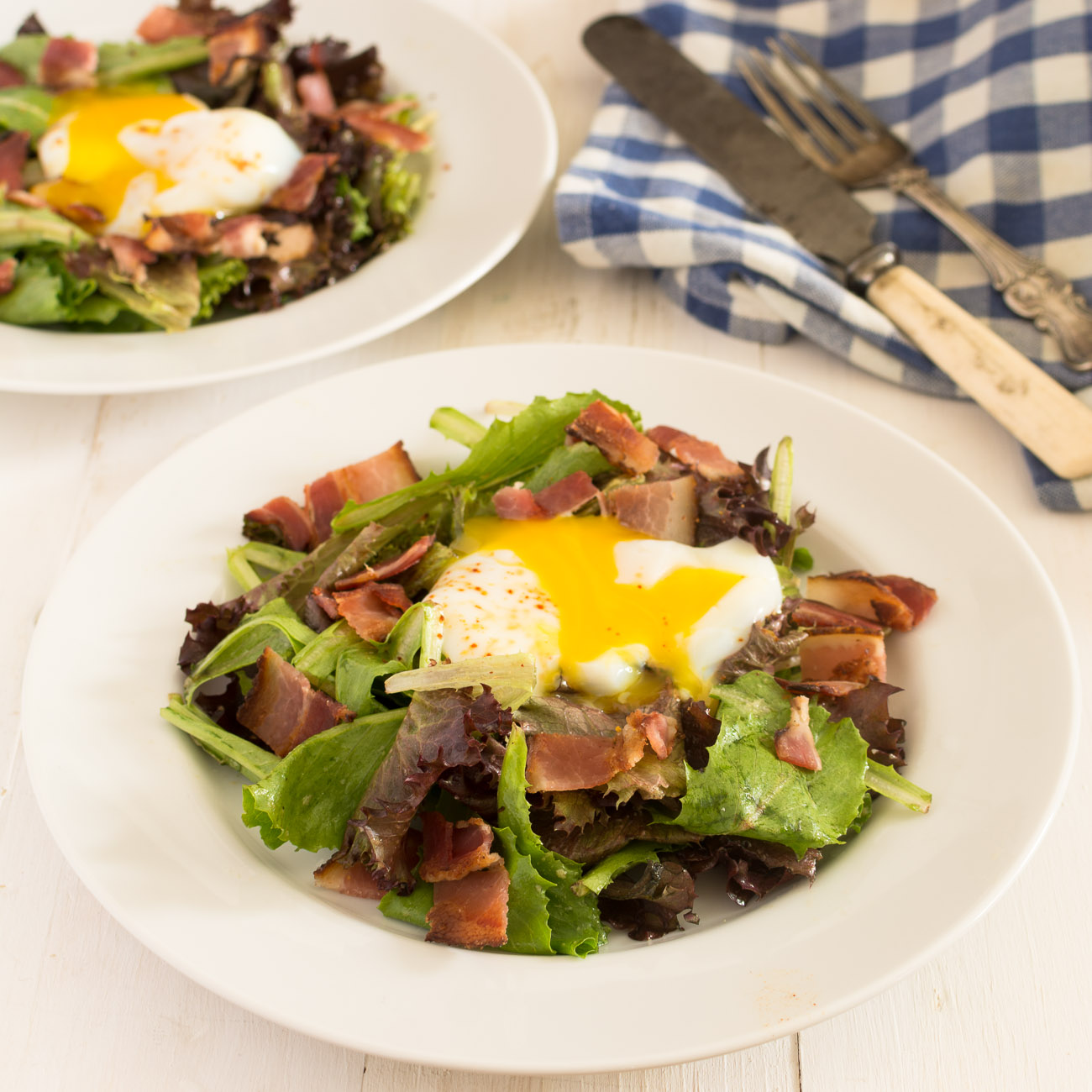 Salade lyonnaise is a classic French salad with poached egg and bacon.