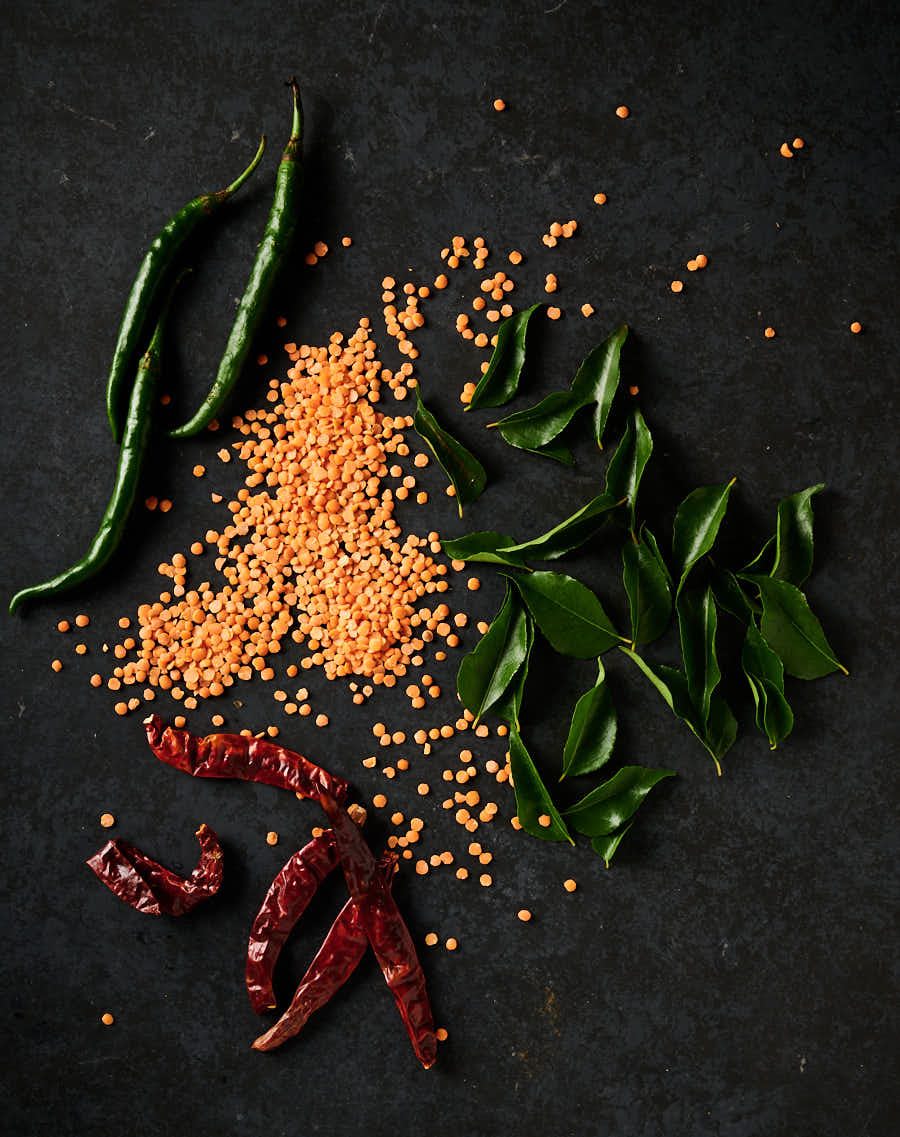 Masoor dal, kashmiri chilies, fresh curry leaves and green chilies from above.