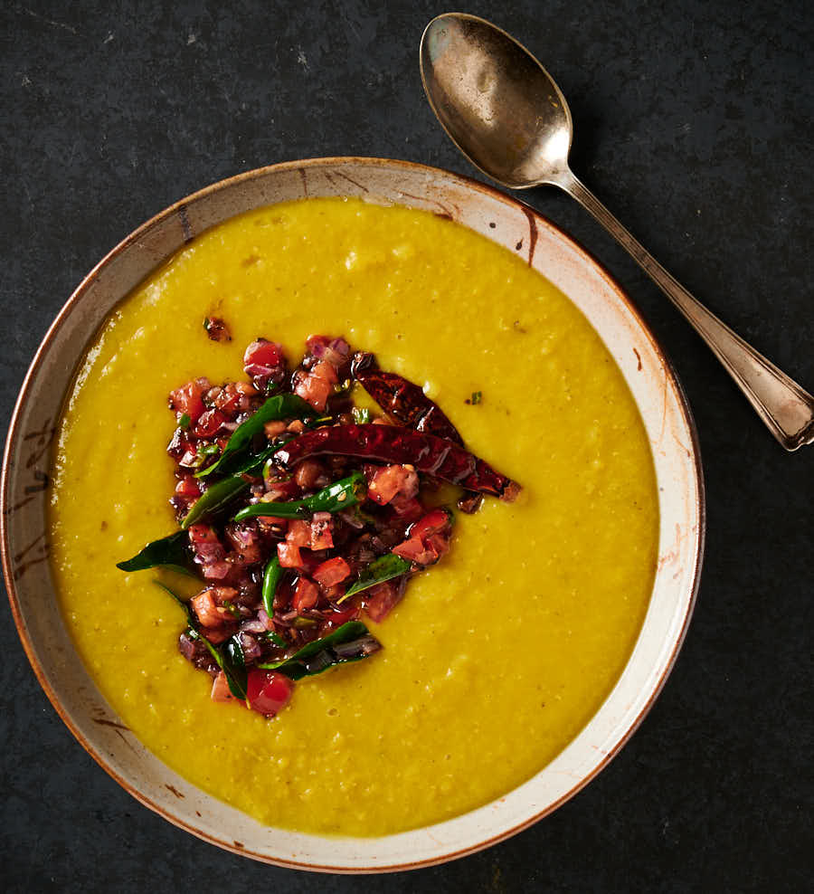 Bowl of dal with tarka spooned on top.