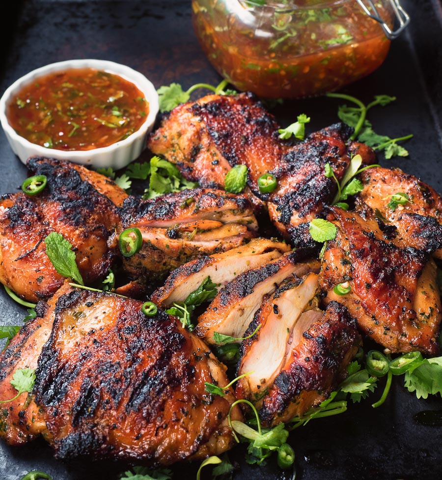 Thai grilled chicken with sweet chili sauce is a delicious way to mix up your summer grilling.