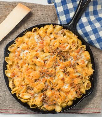 Baked pasta with sausage alfredo sauce is an easy way to get your pasta al forno fix.