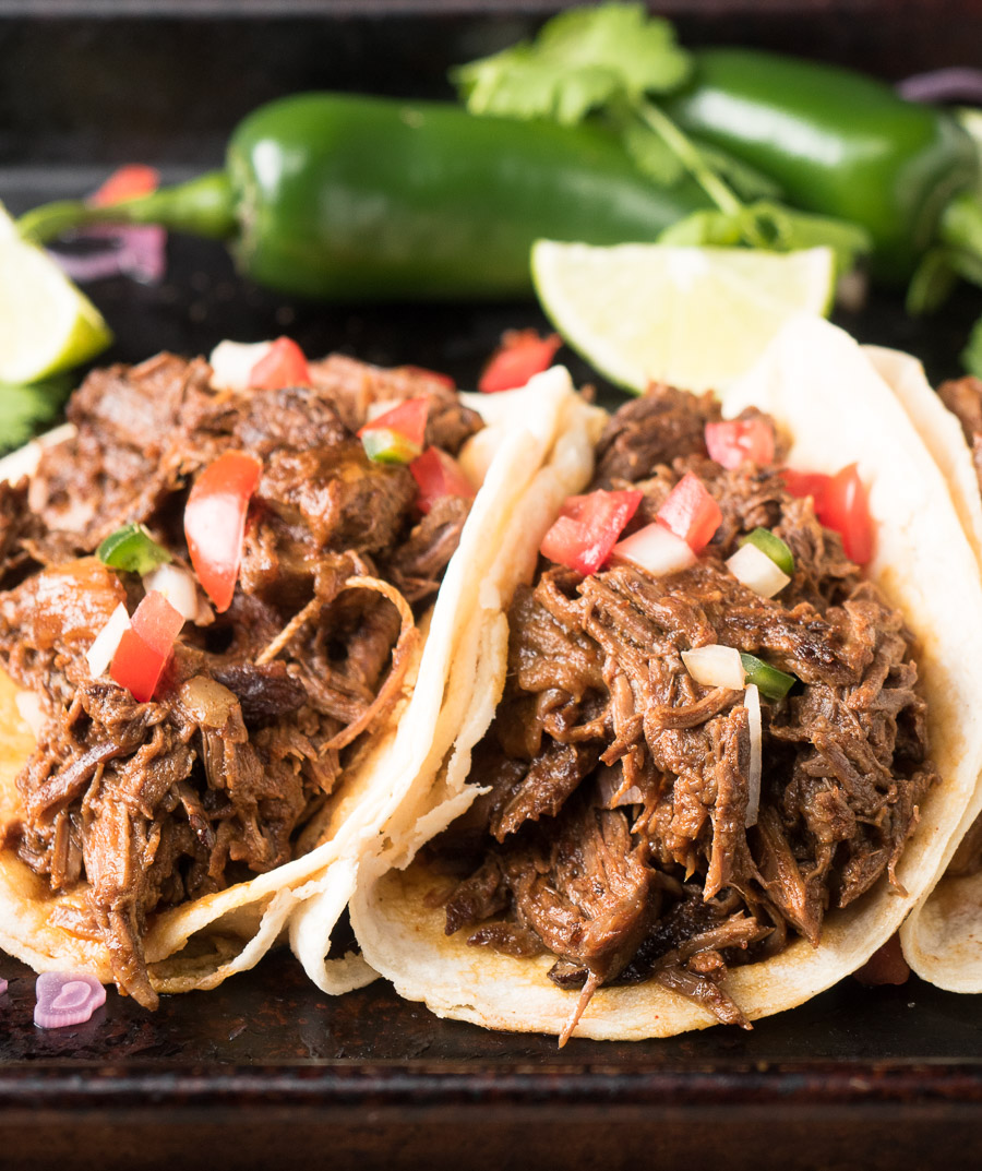 Beef barbacoa tacos up close.