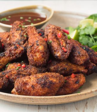 Indian spiced chicken wings with tamarind dipping sauce pack tons of flavour into what is already the world's most perfect food.