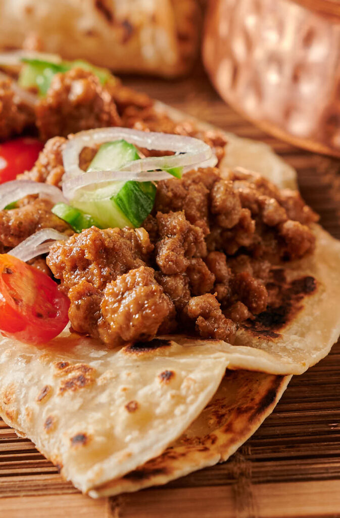 Lamb keema on a paratha - close up from the front.