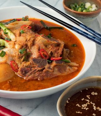 Gamjatang - Korean pork bone soup close up from the front