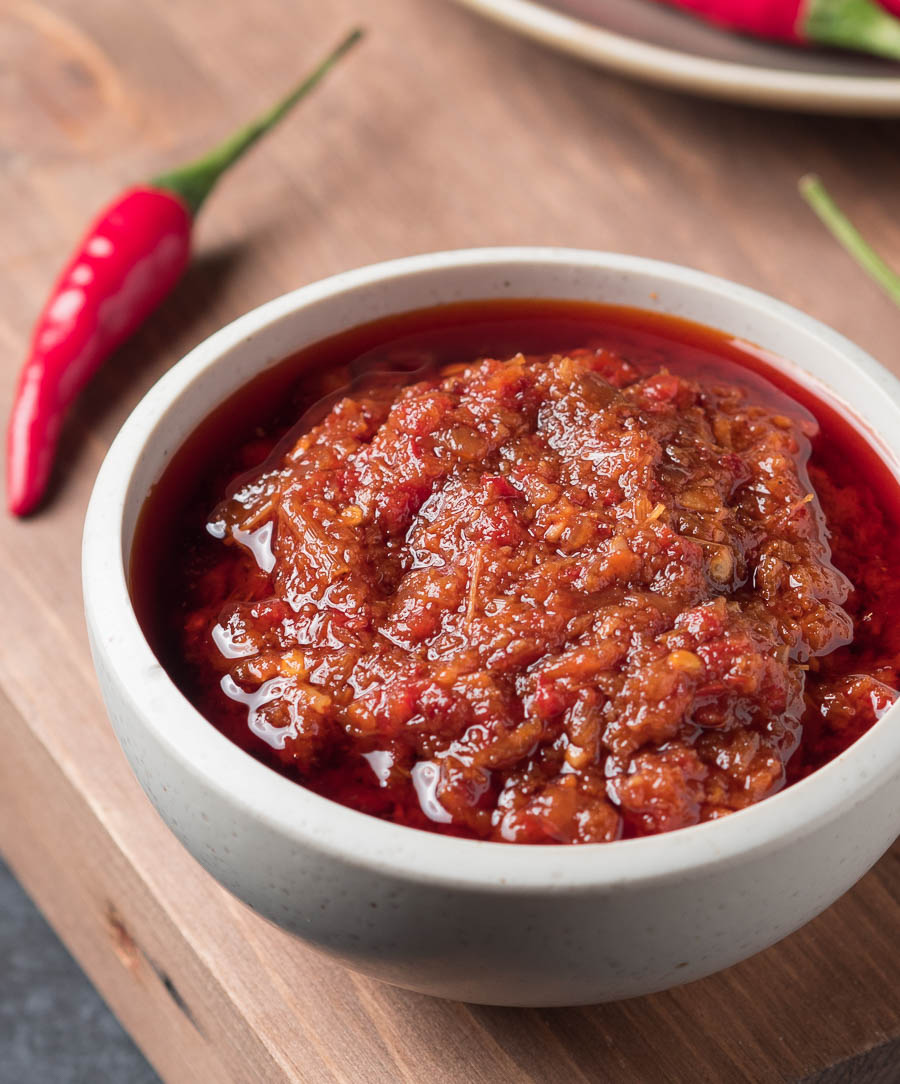 Close up of Vietnamese sate sauce in a white bowl.