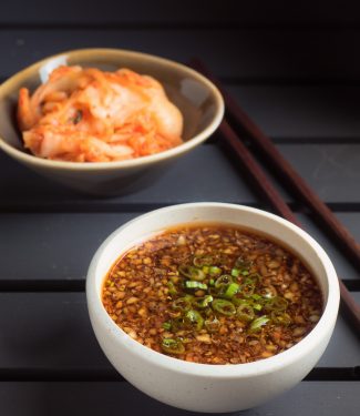 Korean bulgogi sauce in a white bowl on black background.