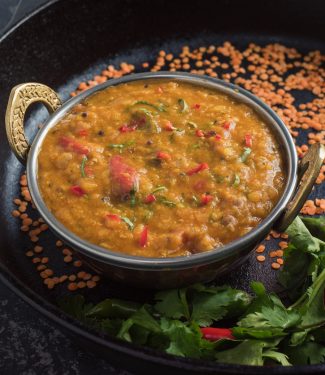 Bengali masoor dal in Indian bowl from the front.