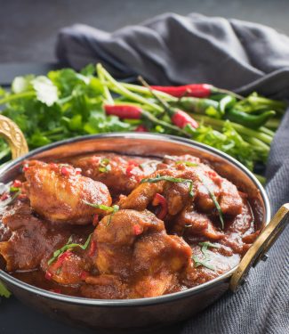 chicken madras in an Indian copper dish