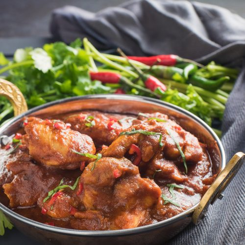 chicken madras in an Indian copper dish