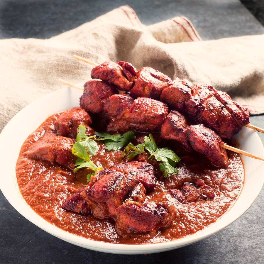 Restaurant style chicken tikka masala with chicken tikka skewers.