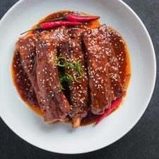 Korean braised pork ribs with sesame seed garnish