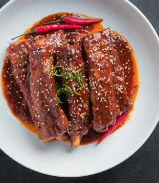 Korean braised pork ribs with sesame seed garnish