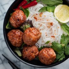 Bun cha in black bowl from above