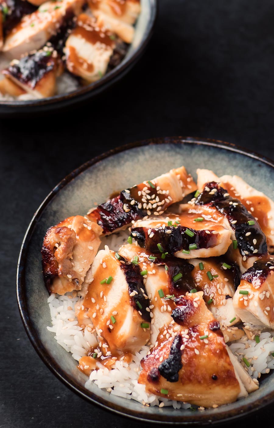 Miso chicken with ginger and maple in a bowl with rice.