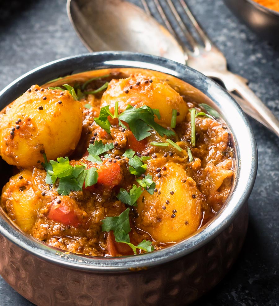 Bombay potatoes with knife and fork.