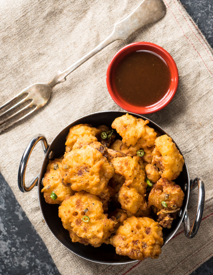 Indian cauliflower wings with spicy tamarind dip.