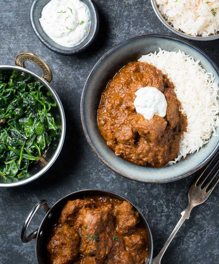 Laal maas with rice and raita from above.