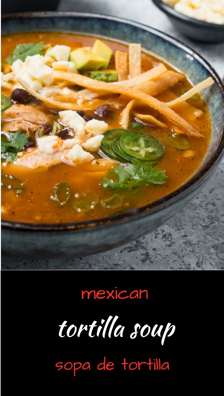 Mexican chicken tortilla soup or sopa de tortilla is a meal in a bowl.