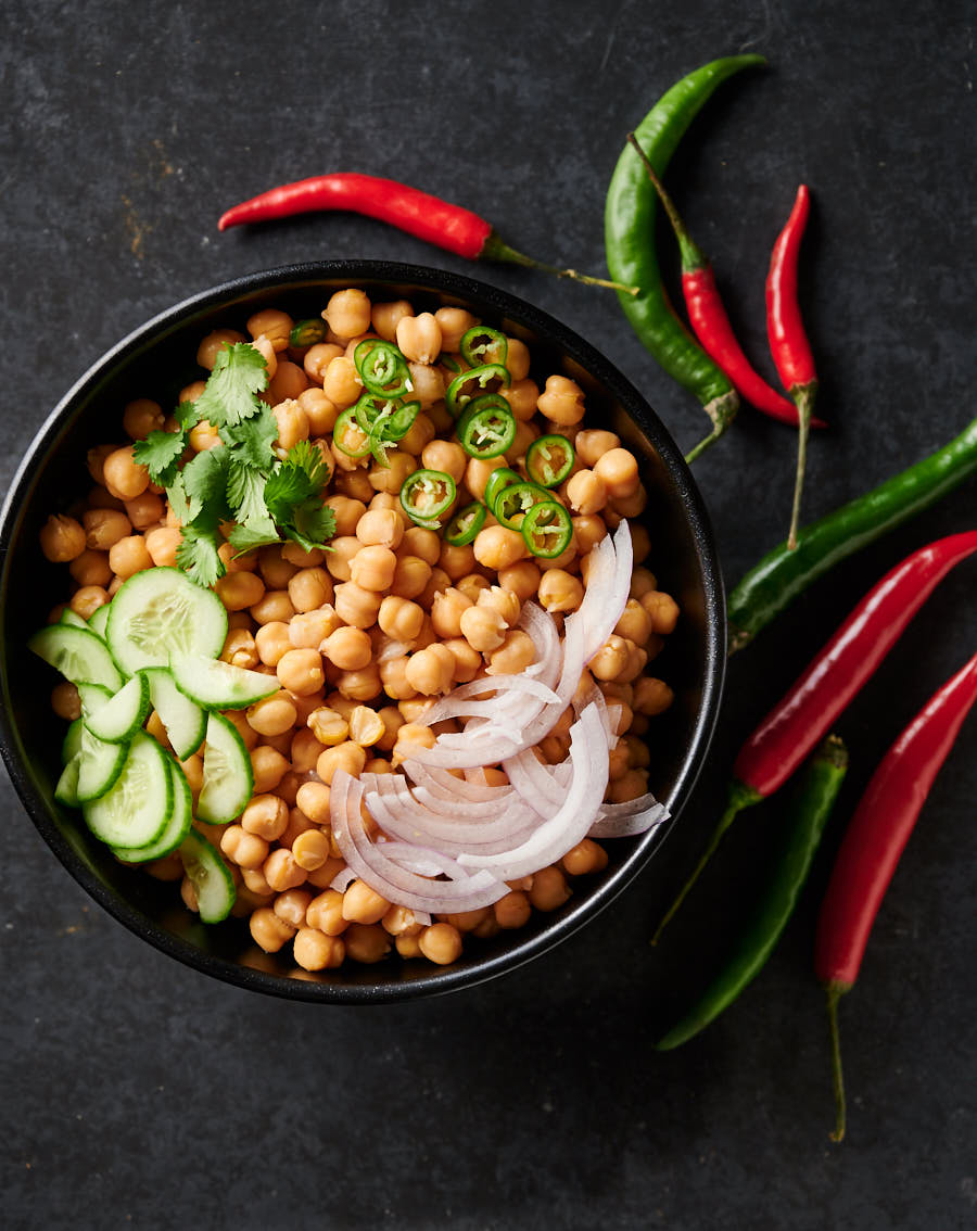 Bowl of chana chaat ingredients. Uncooked.