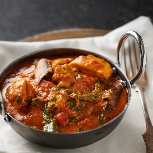 Chicken masala in a bowl from the front.