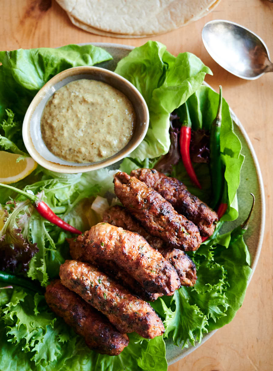 Indian seekh kebab on a platter from above.