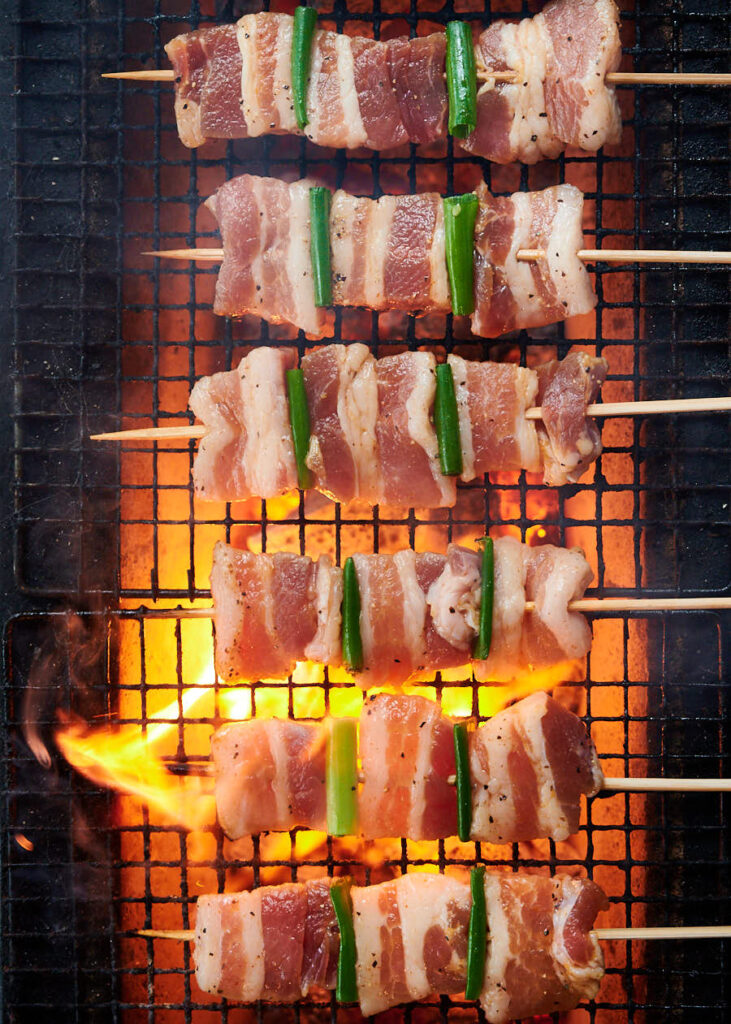 Pork belly skewers on the grill