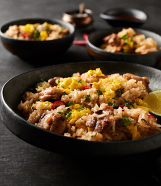 Thai fried rice in a dark bowl from the front.