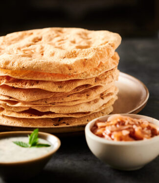 Tall stack of papadum from the front.