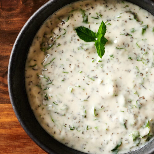 Closeup of a bowl of mint raita from above.