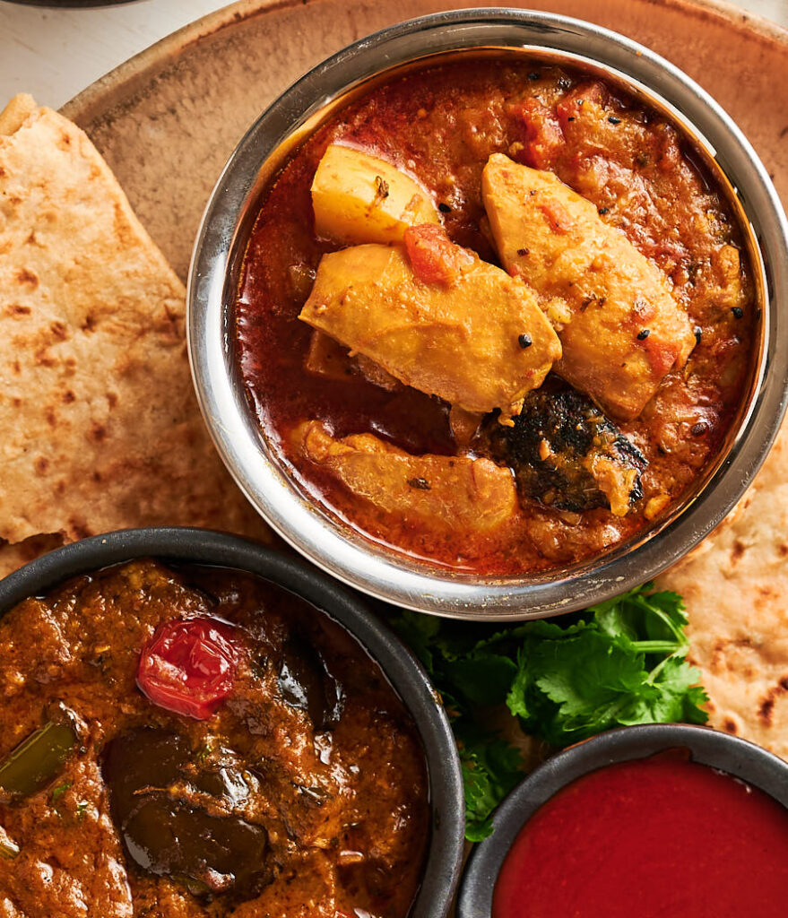 Murgir jhol and eggplant curry from above.