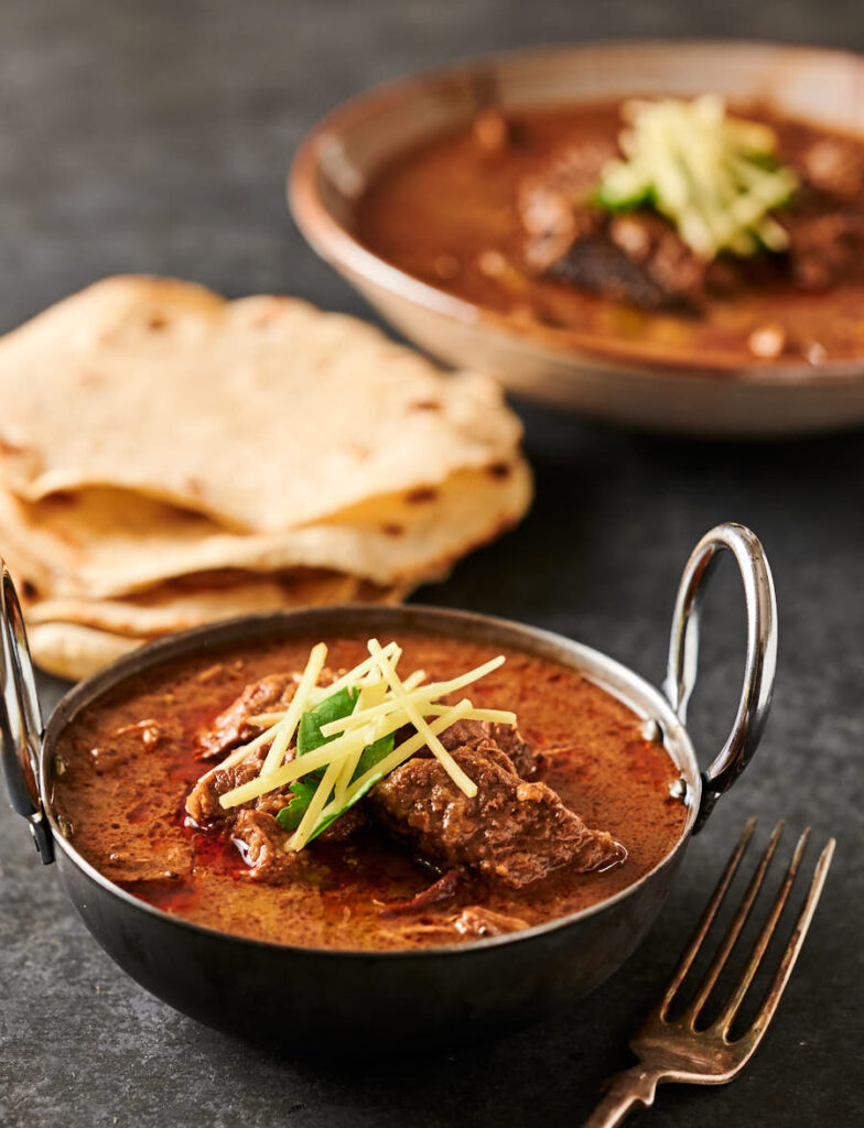 Nihari gosht in an small bowl with chapatis