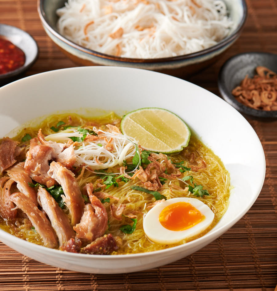 Bowl of soto ayam from the front.