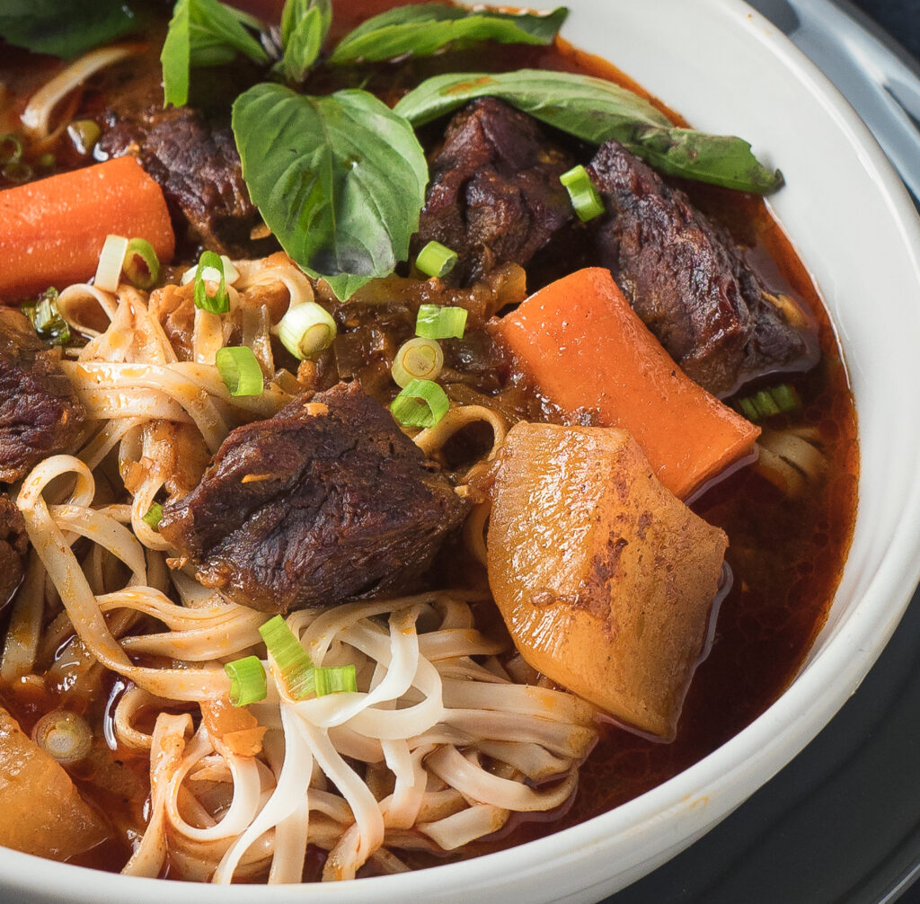 Closeup of a bowl of bo kho from the front.