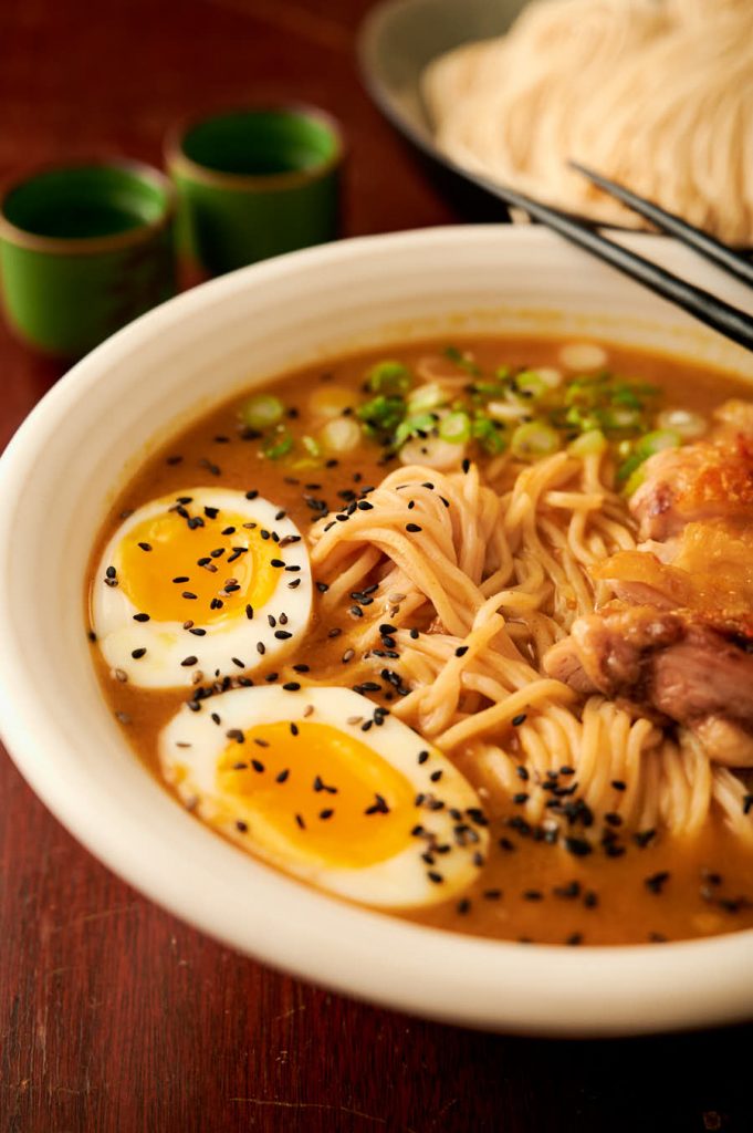 Curry chicken ramen in a white bowl from the front.