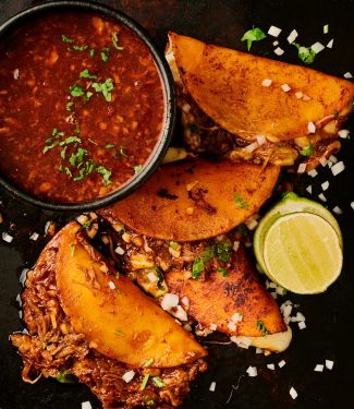 Birria tacos and consomé from above.